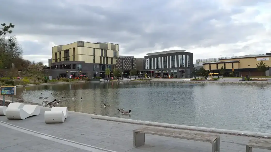 Southwater in Telford, with the pond, library and hotel seen in daylight.