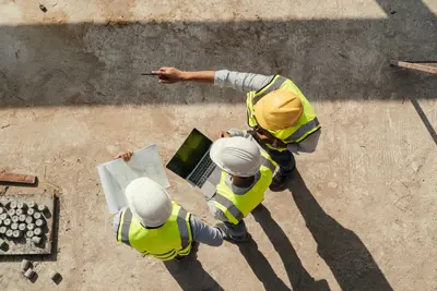 Construction manager coordinating work on an active building project